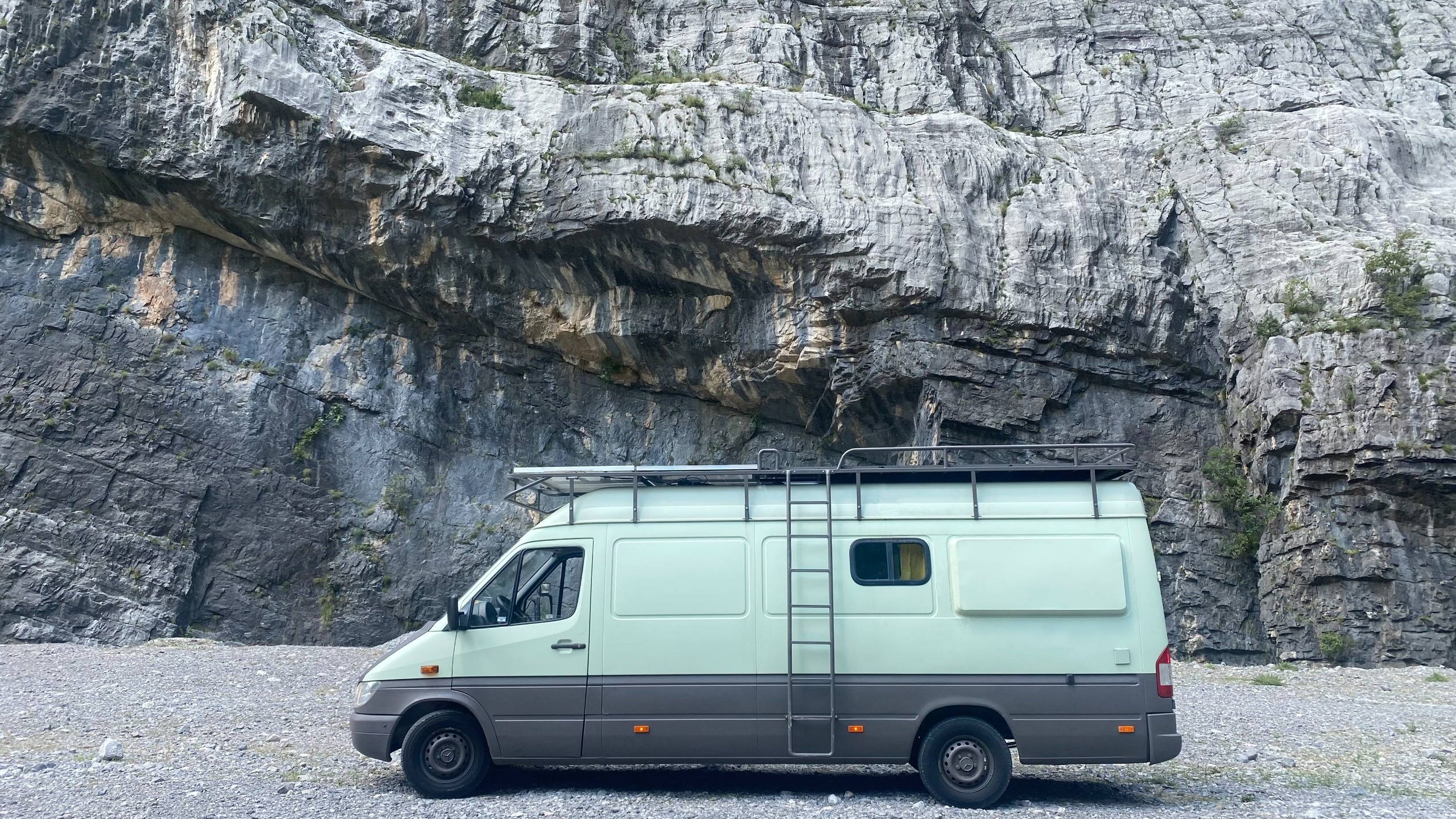Van image on the side with rocky mountain panoramic view
